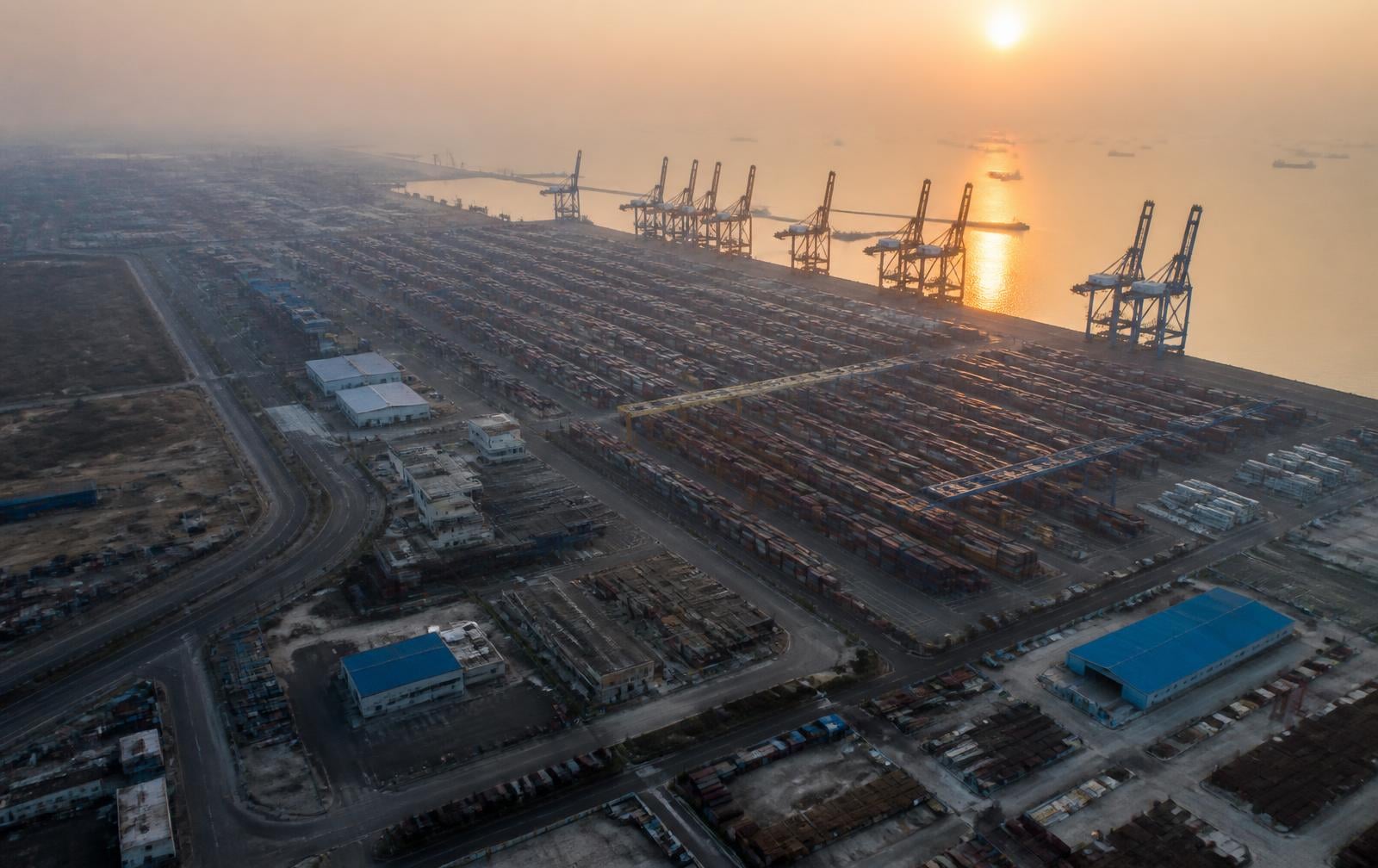 Aerial view of Indian port infrastructure at dawn